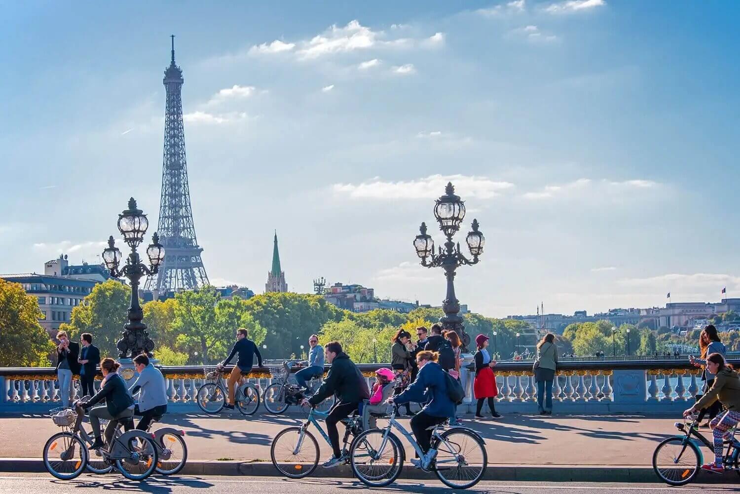 bikes on a bridge in front of the eiffel tower 