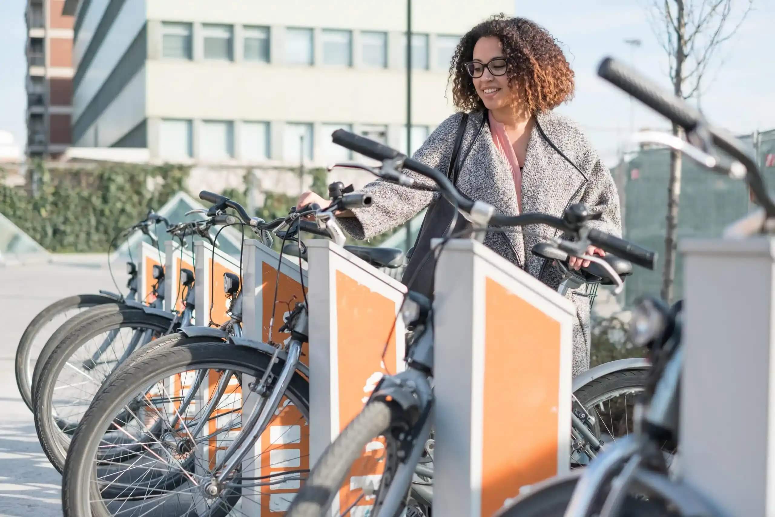 woman taking a shared bike