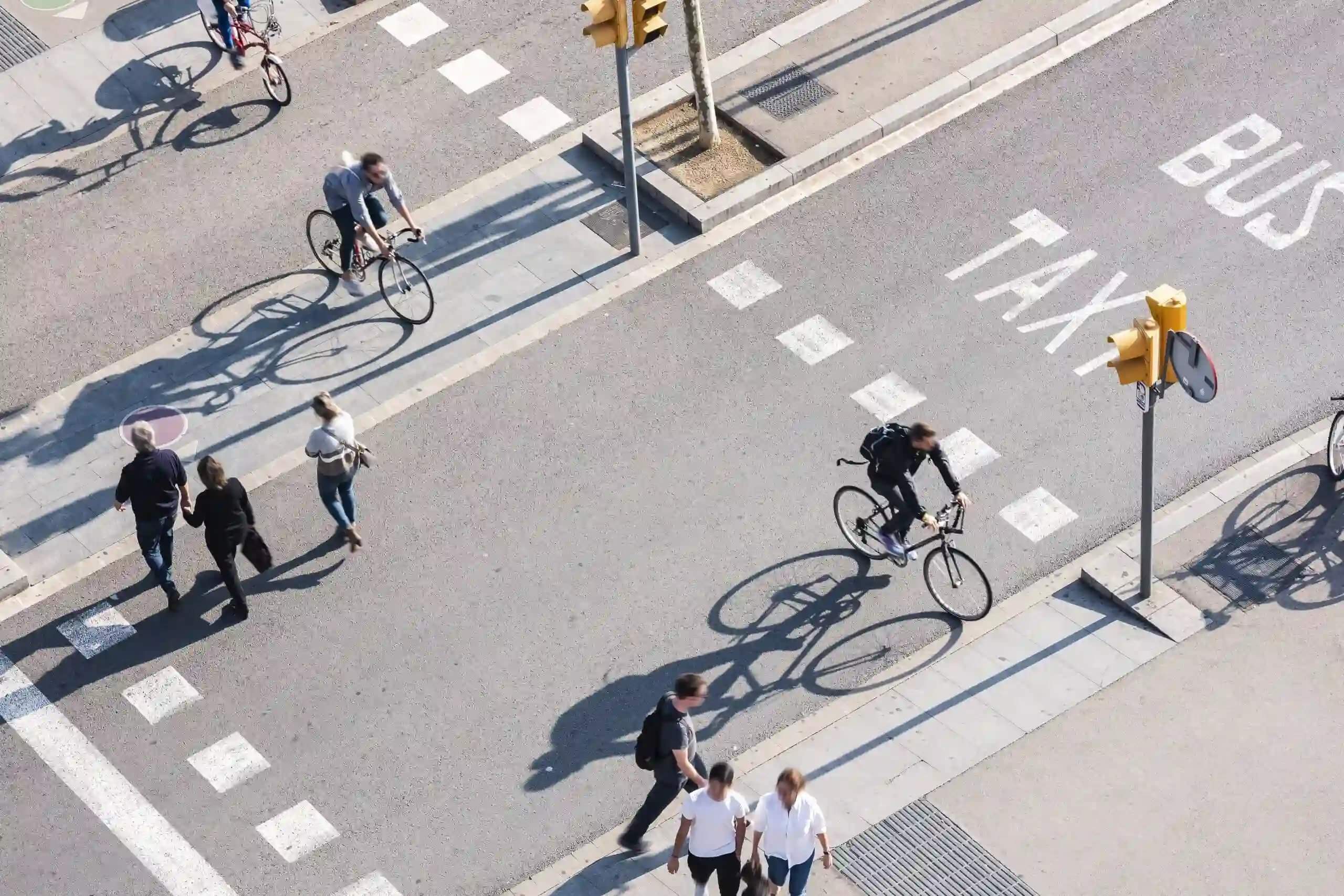 bikes and people walking on a street