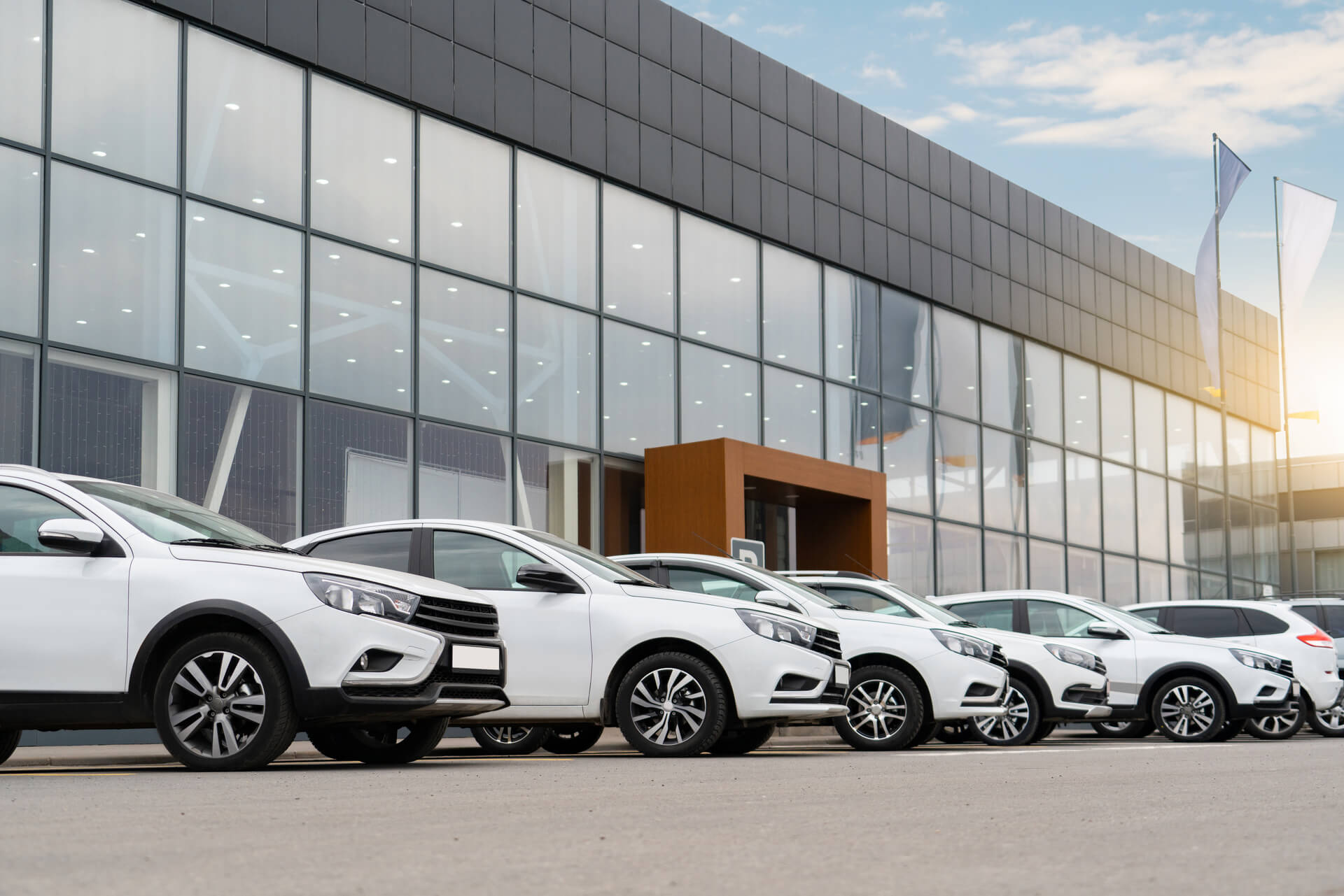 ng technology mobile device online to sell used car or find parking in the city street at home. New car owner young driver girl banner panoramic.